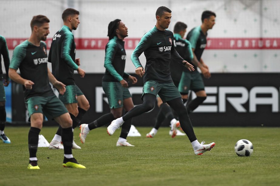 Portugal's Cristiano Ronaldo (right) plays the ball with teammates during the training session of Portugal at the 2018 soccer World Cup in Kratovo, outskirts Moscow, Russia on Wednesday.