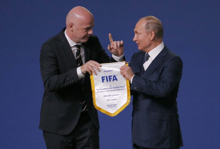 FIFA President Gianni Infantino (left) and Russian President Vladimir Putin pose for cameras at the FIFA congress on the eve of the opener of the 2018 soccer World Cup in Moscow, Russia on Wednesday. The congress in Moscow is set to choose the host or hos