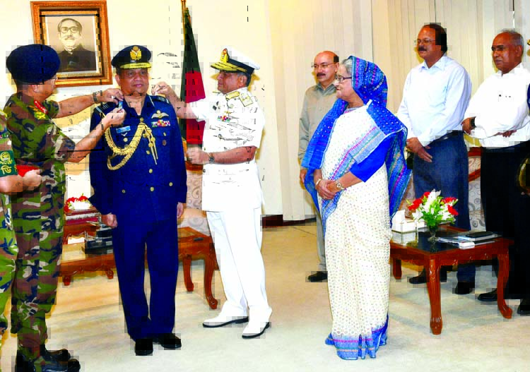 In presence of Prime Minister Sheikh Hasina newly appointed Chief of Air Staff Air Marshal Masihuzzaman Serniabat being adorned with the rank badge of Air Marshal by the Chief of Army Staff Major General Abu Belal Mohammad Shafiul Huq and Chief of Naval S