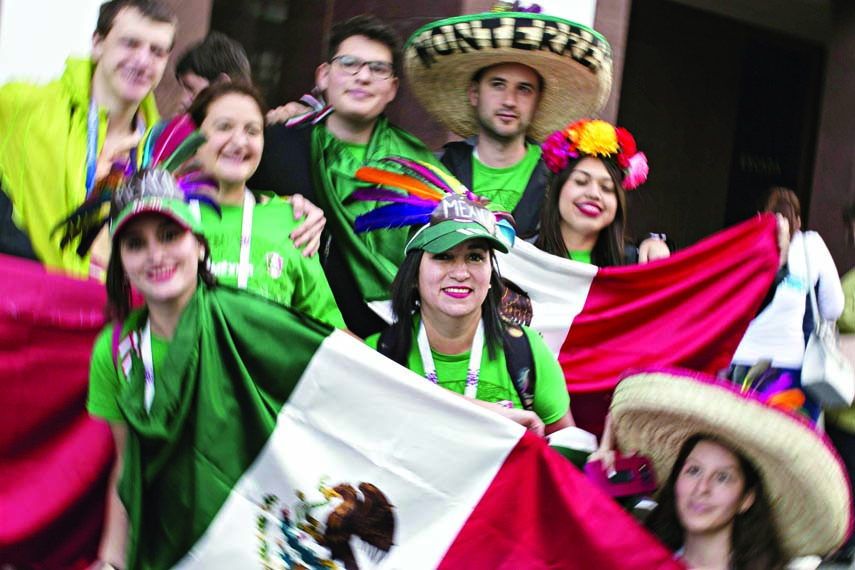 Mexican soccer fans pose for a photo on the eve of the opener of the 2018 soccer World Cup near Red Square in Moscow, Russia on Wednesday.