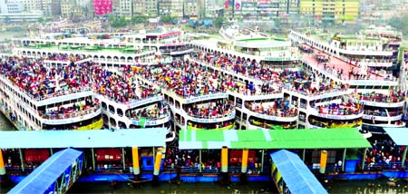 Eid holiday-makers started leaving the capital to enjoy Eid holiday with their near and dear ones risking their lives on roof-top of launches. This picture was taken from Sadarghat launch terminal on Thursday.