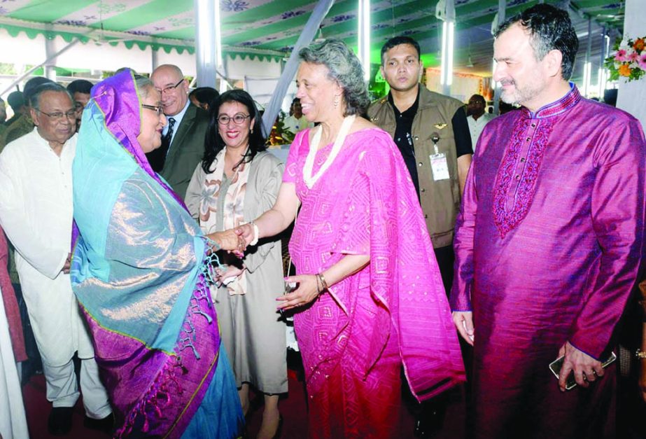 Prime Minister Sheikh Hasina exchanging pleasantries with diplomats at Ganabhaban in the city on Saturday on the occasion of holy Eid-ul-Fitr.