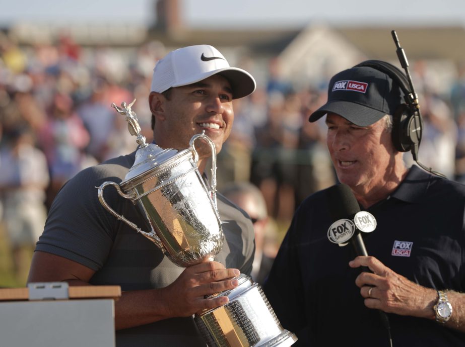Brooks Koepka is interviewed by Curtis Strange after winning the U.S. Open Golf Championship, Sunday in Southampton, N.Y.