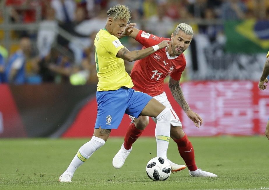 Brazil's Neymar (left) and Switzerland's Valon Behrami challenge for the ball during the group E match between Brazil and Switzerland at the 2018 soccer World Cup in the Rostov Arena in Rostov-on-Don, Russia on Sunday.