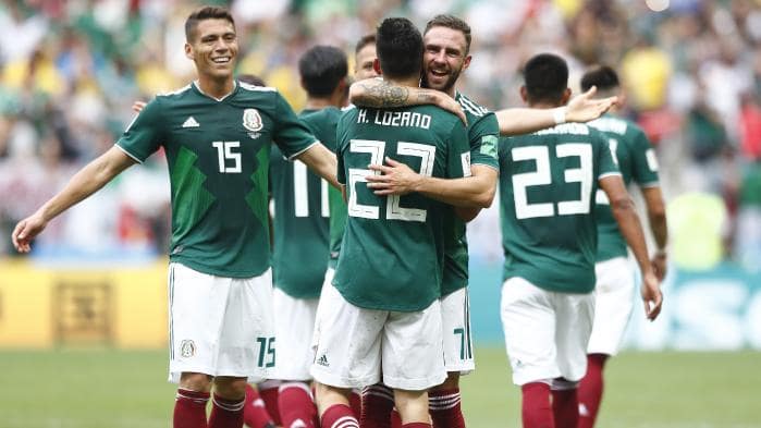Mexican teammates celebrate after scoring the group F match against Germany on Sunday.