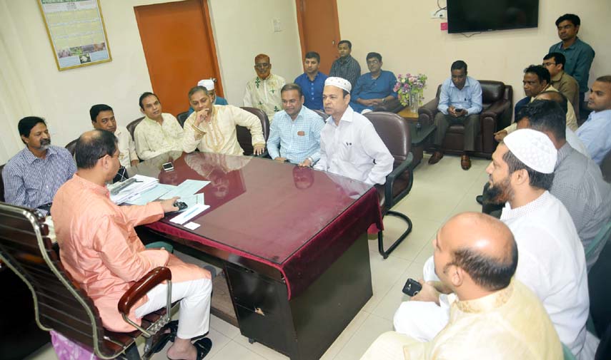 CCC Mayor A J M Nasir Uddin speaking with the CCC engineers over road construction works on Monday.