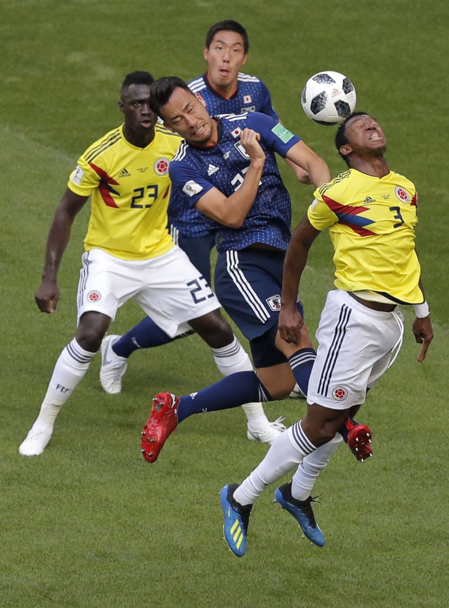 Japan's Maya Yoshida (left) and Colombia's Oscar Murillo (right) go for a header during the group H match between Colombia and Japan at the 2018 soccer World Cup in the Mordavia Arena in Saransk, Russia on Tuesday. Japan beat Colombia 2-1.