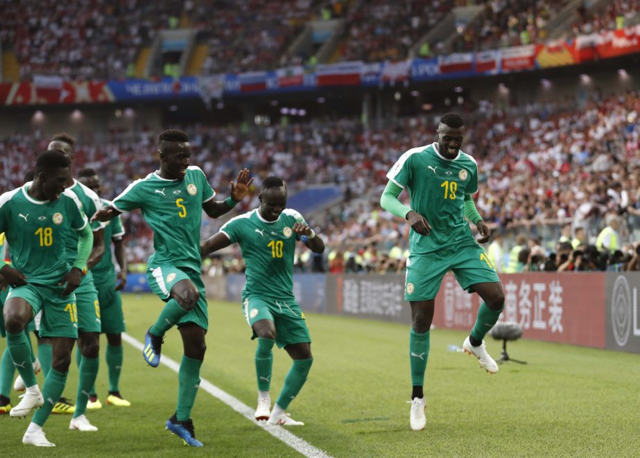 Senegal's Mbaye Niang (right) dances in celebration with his teammates scoring his side's second goalduring the group H match between Poland and Senegal at the 2018 soccer World Cup at the Spartak Stadium in Moscow, Russia on Tuesday.