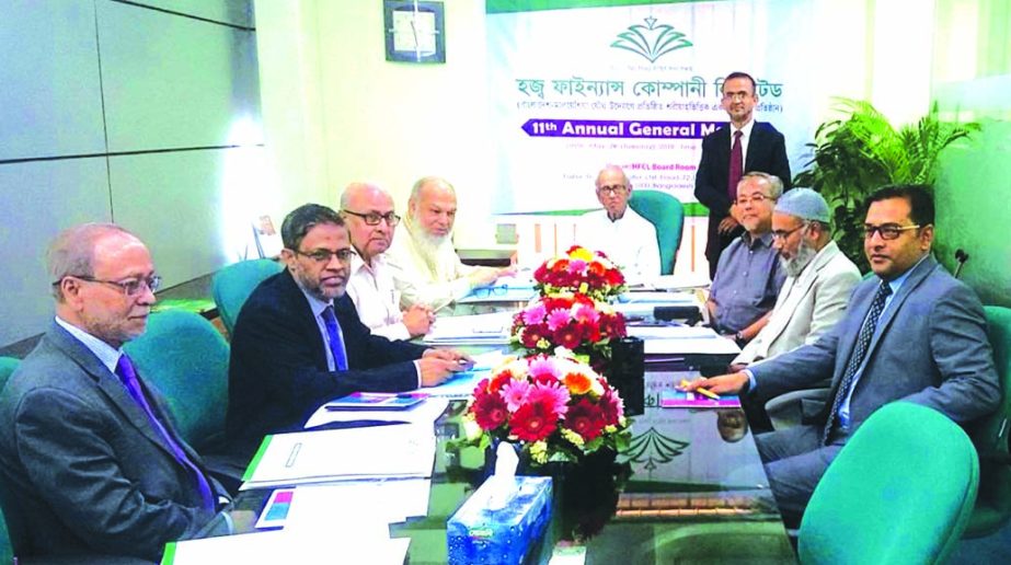 Barrister Rafique Ul Huq, Chairman of Hajj Finance Company Limited (Bangladesh-Malaysia Joint Venture Shariah-based Non-Bank Financial Institution), presiding over its 11th AGM at its head office in the city recently. Directors and top management of the c