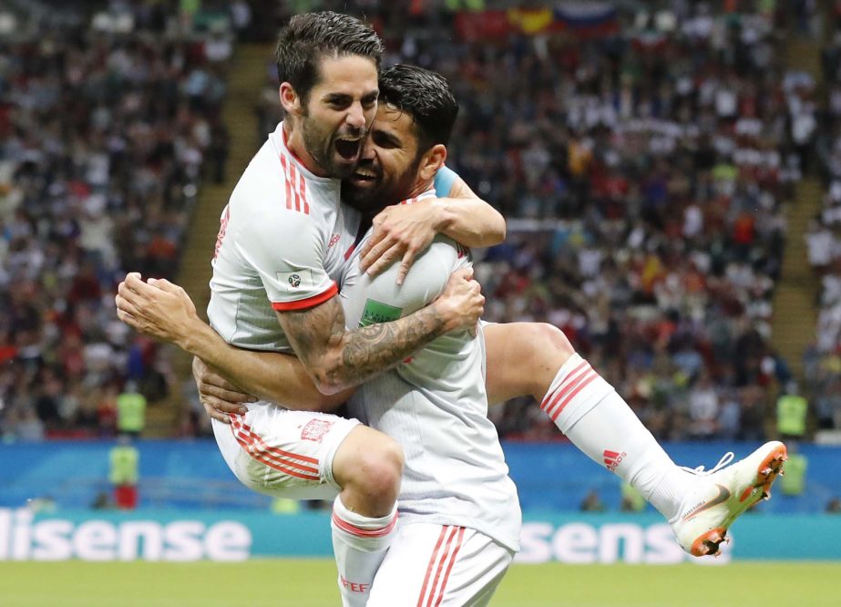 Spain's Diego Costa (right) celebrates with his teammate Isco after scoring his side's opening goal during the group B match between Iran and Spain at the 2018 soccer World Cup at the Kazan Arena in Kazan, Russia, on Wednesday.
