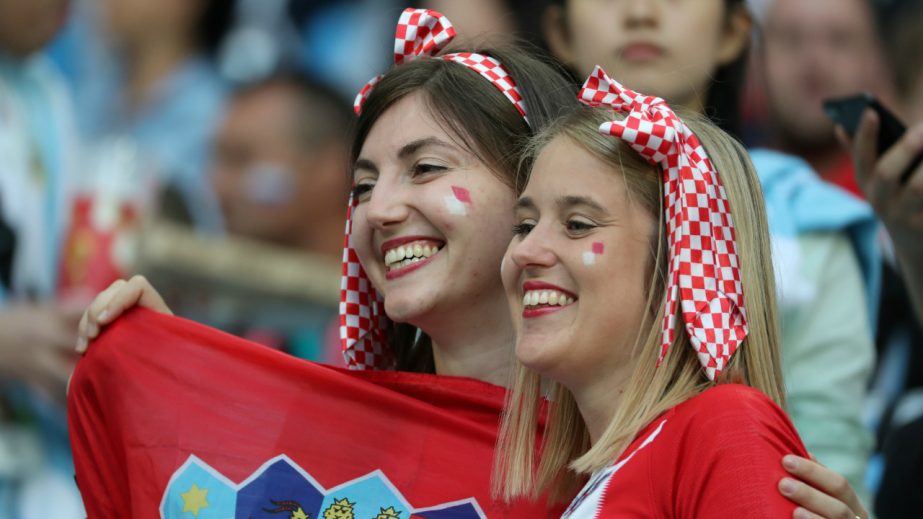 Croatian supporters pose for pictures inside the stadium during the World Cup match between Argentina and Croatia on Thursday.