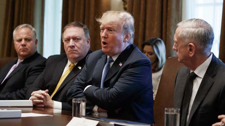 President Donald Trump speaks during a cabinet meeting at the White House on Thursday in Washington. From left, Deputy Secretary of Interior David Bernhardt, Secretary of State Mike Pompeo and Secretary of Defense Jim Mattis.