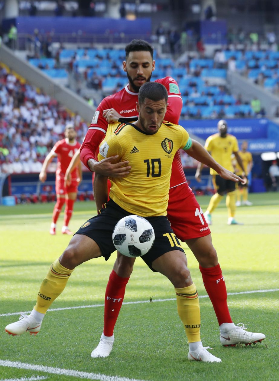 Belgium's Eden Hazard (front) and Tunisia's Dylan Bronn challenge for the ball during the group G match between Belgium and Tunisia at the 2018 soccer World Cup at the Spartak Stadium in Moscow, Russia on Saturday.