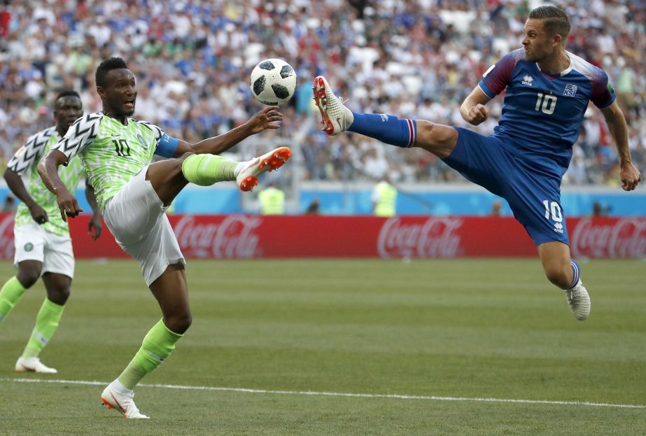 Nigeria's John Obi Mikel (left) and Iceland's Gylfi Sigurdsson compete for the ball during the group D match between Nigeria and Iceland at the 2018 soccer World Cup at the Volgograd Arena in Volgograd, Russia on Friday.