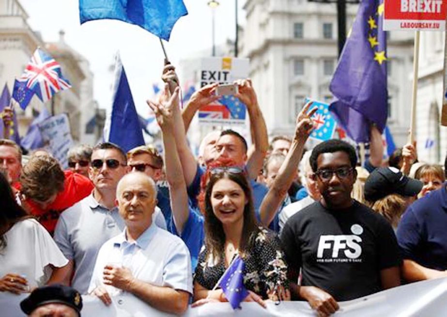 Pro-EU supporters, calling on the government to give Britons a vote on the final Brexit deal, participate in the 'People's Vote' march in central London on Saturday.