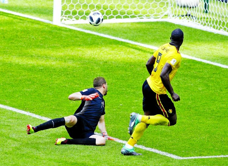 Belgium's Romelu Lukaku, right, scores his side's third goal against Tunisia. (5-2)