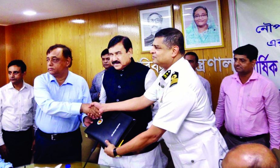 Shipping Minister Shajahan Khan handing over annual work agreement documents to the officials of different institutions of the Ministry after signing the contract at Ministry's Conference Room yesterday.
