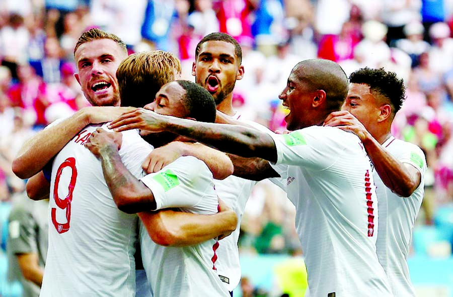 Harry Kane is mobbed after thumping in a second penalty to give England a 6-1 victory against Panama in Russia on Sunday.