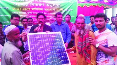 GANGACHARA(Rangpur): State Minister for Local Government, Rural Development and Cooperatives (LGRD) Mashiur Rahman Ranga MP distributing Solar Panel among the poor people at Gangachara Upazila on Sunday.