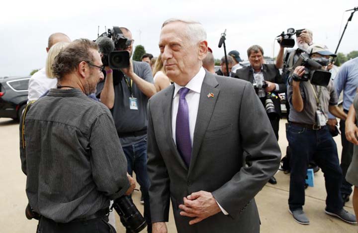 US Defense Secretary Jim Mattis (center) steps away after speaking with the media at the Pentagon.