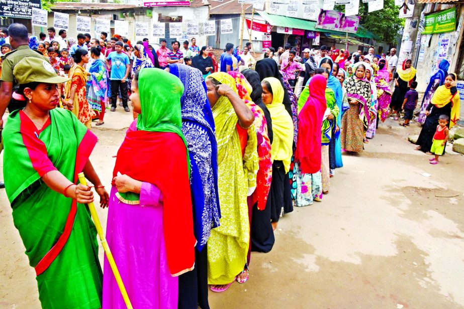 Female voters in queue at the United Model Academy to cast their votes for Gazipur City Corporation election on Tuesday.