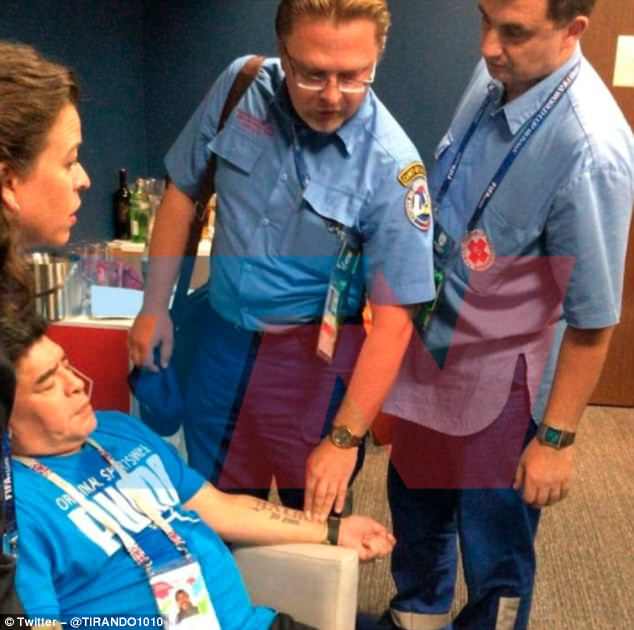 A picture showed two medical members of medical staff seemingly assisting Maradona.