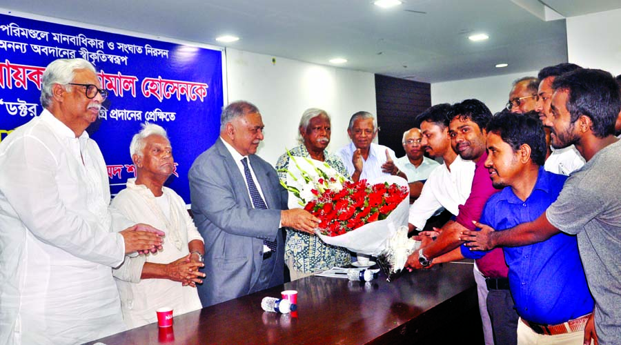 Leaders and activists of Jatiya Juba Oikya Prokriya accord reception to Convenor of Jatiya Oikya Prokriya Dr Kamal Hossain for receiving 'Doctor of Law' from Notre Dame University of the United States giving bouquet at the Jatiya Press Club on Thursday.