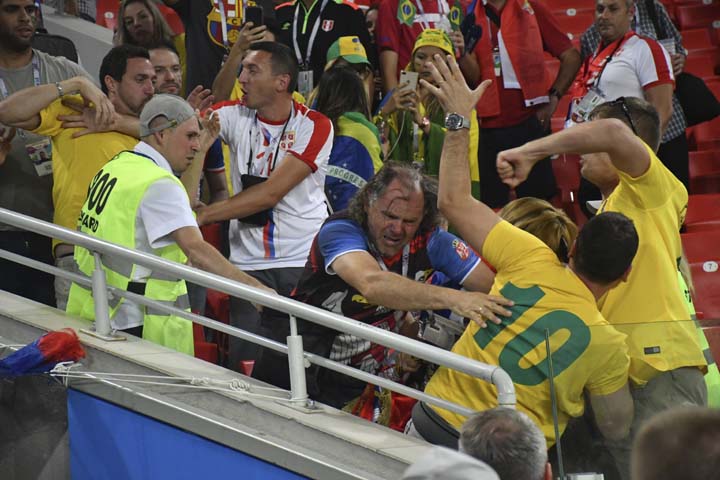 Serbia and Brazilia soccer fans fight each other during the group E match between Serbia and Brazil, at the 2018 soccer World Cup in the Spartak Stadium in Moscow, Russia on Wednesday.