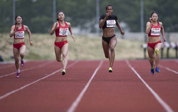 Zhou Yanbing of China (second-place), Ge Manqi of China (fourth-place), Phylicia George of Canada and first-place Huang Guifen of China (from left) compete in the women's 200 meters at the Harry Jerome International Track Classic on Wednesday in Burnaby