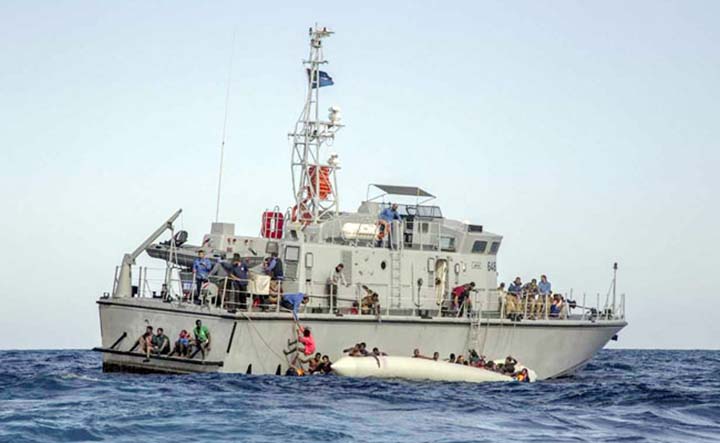 Migrants arrive at a naval base after being rescued by Libyan coast guards in Tripoli on Friday.