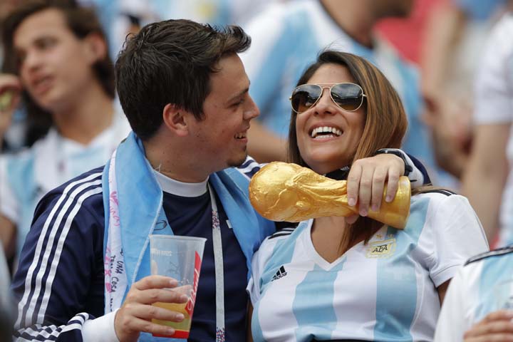 Argentine fans hug before the start of the round of 16 match between France and Argentina, at the 2018 soccer World Cup at the Kazan Arena in Kazan, Russia on Saturday.