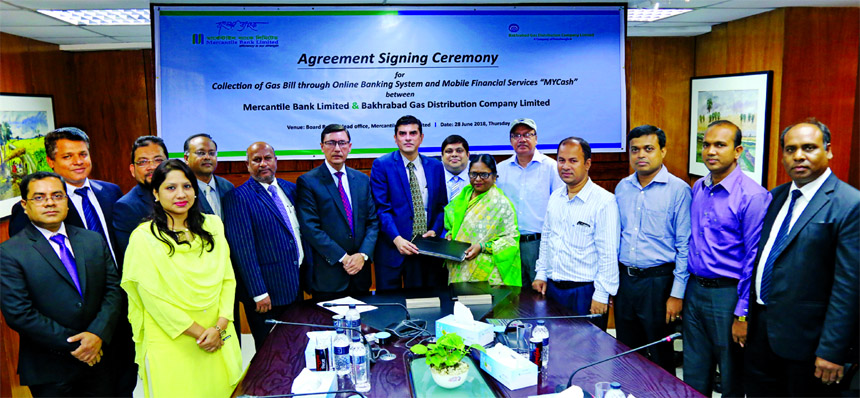 Adil Raihan, Deputy Managing Director of Mercantile Bank Limited and Afroza Begum, Company Secretary of Bakhrabad Gas Distribution Company Limited, exchanging an agreement signing documents at the banks head office in the city recently. Under the deal, th