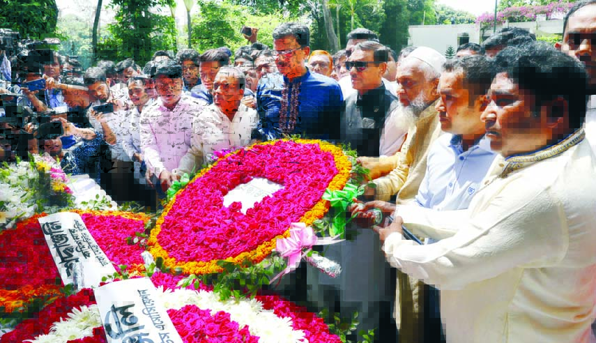 Secretary General of Awami League and Road Transport and Bridges Minister Obaidul Quader with party leaders placing wreaths in observance of the second anniversary of Holey Artisan cafe attack yesterday.