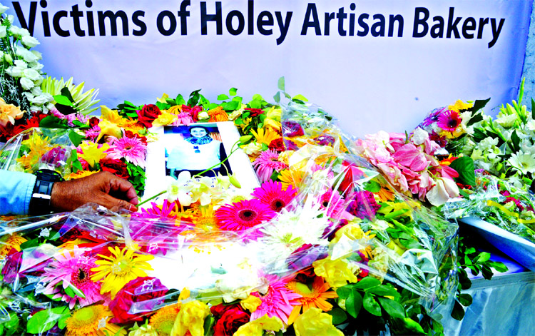 Marking the second anniversary of Holey Artisan Bakery tragedy, the place of occurrence bedecked with flowers placed by family members and various organisations on Sunday.