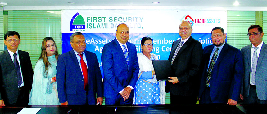 Syed Waseque Md Ali, Managing Director of First Security Islami Bank Limited and Azizunnessa Huq (Dolly), Executive Director of Fintech Innovations International, exchanging an agreement documents at the bank's head office in the city on Tuesday. Under t