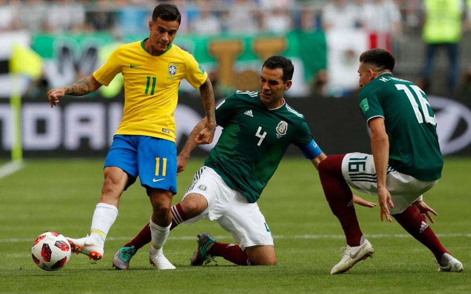 Rafael Marquez tries to tackle Philippe Coutinho in the World Cup last-16 match between Brazil and Mexico in Samara on Monday.