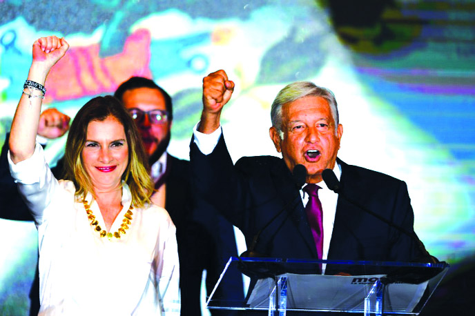 Newly elected Mexican president Andres Manuel Lopez Obrador Â® next to his wife Beatriz Gutierrez Muller.