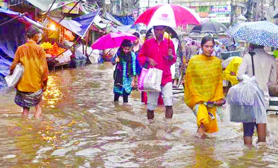 Due to incessant and heavy rain, the low-lying areas of Chattogram have been inundated causing sufferings to the people. This picture was taken from city's Chawkbazar area on Tuesday.