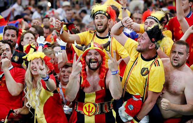 Delighted Belgian fans celebrate after Belgium knocked Japan out of the World Cup.
