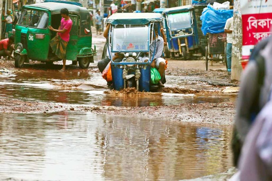 Motorised vehicles and also pedestrians struggle through the stagnated rain water for long, but the authorities concerned seemed to be blind to repair the road to mitigate the woes of the road users. The snap was taken from Sarulia area in Demra on Friday