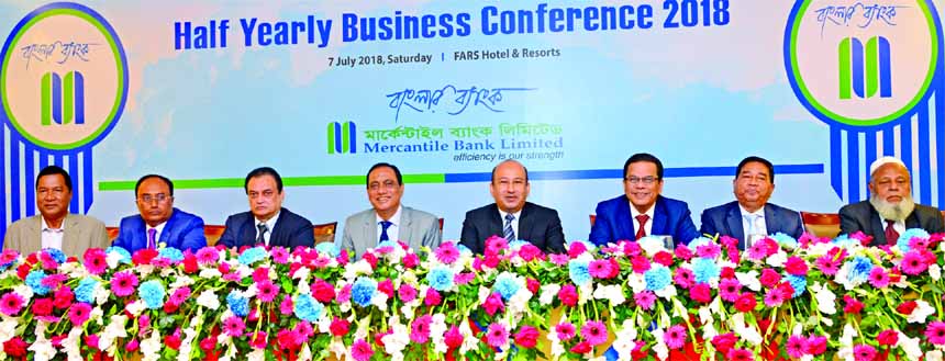 Kazi Masihur Rahman, Managing Director of Mercantile Bank Limited, presiding over its half yearly business conference at a hotel in the city on Saturday. A.K.M. Shaheed Reza, Chairman of the Board of Directors of the bank, A.S.M. Feroz Alam, Vice Chairman