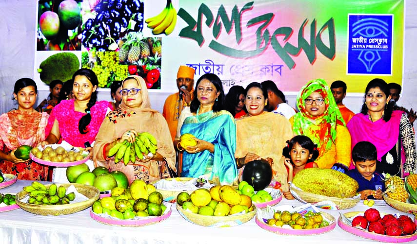 Participants at the fruits festival organised by the Jatiya Press Club in its auditorium on Saturday.