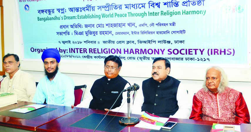 Shipping Minister Shajahan Khan speaking at a discussion on 'Bangabandhu's Dream: Establishing World Peace Through Inter Religion Harmony' organised by Inter Religion Harmony Society at the Jatiya Press Club on Saturday.