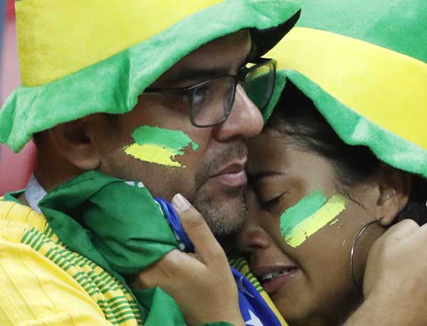 Brazil's supporters react after their team loose the quarterfinal match against Belgium on Friday.