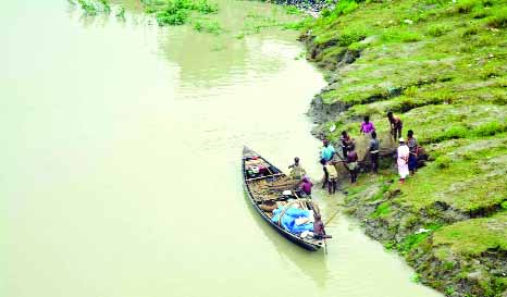 BARISHAL: Flood affected families moving for safer place as Arial Khan River erosion has taken a serious turn at Muladi Upazila . This snap was taken from Kachirchar village on Saturday.