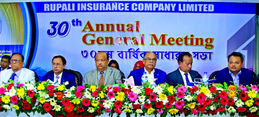 Mostafa Golam Quddus, Chairman of Rupali Insurance Company Limited, presiding over its 30th AGM at a convention centre in the city recently. The AGM approved 10 percent dividend for the shareholders for the year 2017. PK Roy, CEO, Quazi Moniruzzaman, Jinn