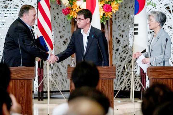 U.S. Secretary of State Mike Pompeo shaking hands with Japan's Foreign Minister Taro Kono in Tokyo on Sunday.