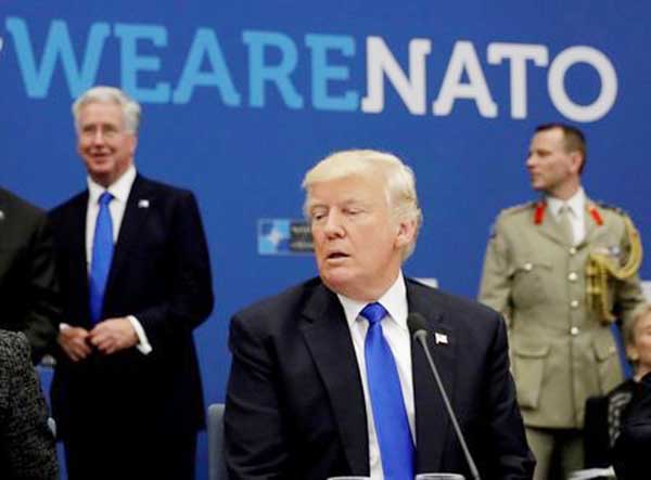 U.S. President Donald Trump attends a working dinner meeting at the NATO headquarters during a NATO summit of heads of state and government in Brussels, Belgium. AP file photo