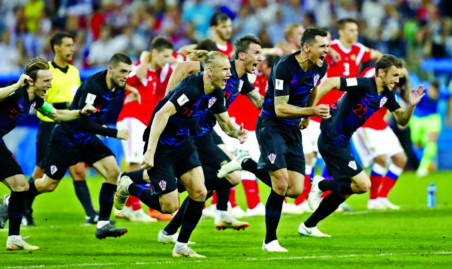 Croatia players celebrate after scoring last penalty spot in a shootout at the end the quarterfinal match between Russia and Croatia at the 2018 soccer World Cup in the Fisht Stadium, in Sochi, Russia on Saturday.