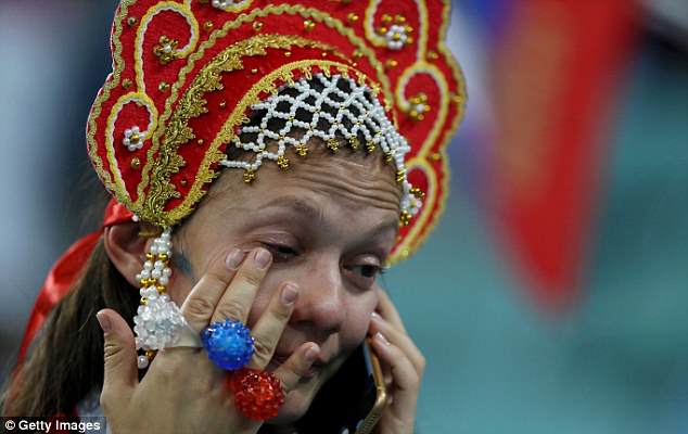 A Russian fan looks dejected after the host nation were knocked out by Croatia on penalties.